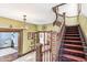 View of a grand staircase with intricate woodwork at 1800 S Sherman St, Denver, CO 80210