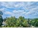 Scenic view of mountains and treetops from a home window at 1800 S Sherman St, Denver, CO 80210
