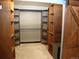 Large walk-in closet with custom wood shelving, barn door and ample storage space at 720 16Th St # 421, Denver, CO 80202