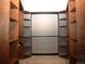 Large walk-in closet with custom wood shelving and ample storage space at 720 16Th St # 421, Denver, CO 80202