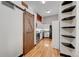 Modern kitchen with sleek white cabinets, stainless steel appliances, and a rustic barn door detail at 720 16Th St # 421, Denver, CO 80202