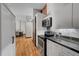 Bright kitchen featuring stainless steel appliances, granite countertops, and hardwood floors at 720 16Th St # 421, Denver, CO 80202