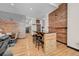 Open-concept living space featuring exposed wood accents, stylish decor and rustic bar with seating at 720 16Th St # 421, Denver, CO 80202