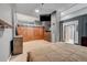 Spacious main bedroom with a barn door closet, tv, and ensuite bathroom at 720 16Th St # 421, Denver, CO 80202