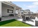 Outdoor living space with comfortable seating and an outdoor dining set at 777 Gold Hill Dr, Erie, CO 80516