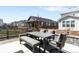 A backyard featuring a dining table and chairs, along with a view of neighboring homes at 777 Gold Hill Dr, Erie, CO 80516