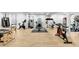 The basement offers a fully equipped home gym featuring treadmills, weight machines, and mirrored walls at 777 Gold Hill Dr, Erie, CO 80516