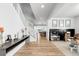Inviting foyer with a staircase and view into the open-concept kitchen and playroom at 777 Gold Hill Dr, Erie, CO 80516