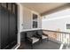 Inviting front porch with chairs and a black front door, great for relaxing and enjoying the neighborhood view at 777 Gold Hill Dr, Erie, CO 80516