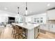 Spacious kitchen island with seating, complemented by an open-concept layout and modern appliances at 777 Gold Hill Dr, Erie, CO 80516