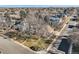 Aerial view of a house and neighborhood, highlighting the property's curb appeal and street view at 2 Elm St, Denver, CO 80220