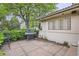 Outdoor patio with a barbecue grill, surrounded by lush landscaping at 2 Elm St, Denver, CO 80220