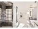 Elegant bathroom with a glass-block shower, soaking tub and separate vanities at 2 Elm St, Denver, CO 80220