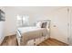 Simple bedroom with light walls and hardwood floors at 2 Elm St, Denver, CO 80220
