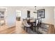 Sophisticated dining space adjacent to the kitchen, featuring hardwood floors and a pendant light at 2 Elm St, Denver, CO 80220