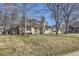 Beautiful home with a large front yard and mature trees at 2 Elm St, Denver, CO 80220