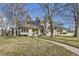 Stunning two-story home with manicured lawn and mature trees at 2 Elm St, Denver, CO 80220