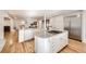 Spacious kitchen with stainless steel appliances, granite countertops and large center island with gas cooktop at 2 Elm St, Denver, CO 80220