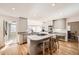 Bright kitchen with an island, breakfast bar, stainless steel appliances, and ample counter space at 2 Elm St, Denver, CO 80220
