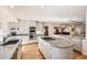 Modern kitchen featuring granite countertops, stainless steel appliances and a gas cooktop on the center island at 2 Elm St, Denver, CO 80220