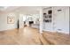 Open-concept floor plan with hardwood floors, custom built-in shelving, and lots of natural light at 2 Elm St, Denver, CO 80220