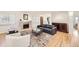 Cozy living area featuring a fireplace, comfortable seating, and hardwood flooring at 2 Elm St, Denver, CO 80220