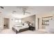 Spacious main bedroom has a ceiling fan, sitting area, ensuite bathroom, and walk-in closet at 2 Elm St, Denver, CO 80220