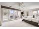 This large main bedroom features balcony access, a ceiling fan, and ensuite bathroom at 2 Elm St, Denver, CO 80220