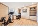 Office space with built-in desk and shelving, plus a Murphy bed and modern exercise equipment at 2 Elm St, Denver, CO 80220