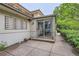 Outdoor patio with tiled flooring and a path leading to the garden at 2 Elm St, Denver, CO 80220