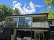 Back porch featuring bright sky light reflections and a white railing at 6948 W 70Th Ave, Arvada, CO 80003