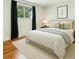 Inviting bedroom with a plush bed, soft lighting, and stylish decor creating a comfortable and relaxing atmosphere at 6948 W 70Th Ave, Arvada, CO 80003