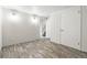 Functional bedroom with neutral walls, vinyl plank flooring, and simple lighting, a blank slate for personalization at 6948 W 70Th Ave, Arvada, CO 80003