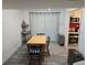 Bright dining area with wood table, seating for four, and adjacent updated kitchen at 6948 W 70Th Ave, Arvada, CO 80003