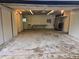 Spacious two-car garage with storage cabinets, suitable for parking vehicles and storing belongings at 6948 W 70Th Ave, Arvada, CO 80003