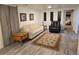 Inviting living room with a leather sofa, chairs, and a decorative rug on luxury vinyl floors at 6948 W 70Th Ave, Arvada, CO 80003