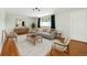 Bright and airy living room with hardwood floors, stylish furnishings, and ample natural light at 6948 W 70Th Ave, Arvada, CO 80003