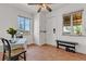 Bright dining area with a window, table, seating, and easy access to an exit door at 15205 W 43Rd Ave, Golden, CO 80403
