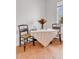 Charming dining area featuring a small table, two chairs, and a window for natural light at 15205 W 43Rd Ave, Golden, CO 80403