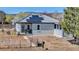 Charming home exterior with solar panels and fenced yard at 15205 W 43Rd Ave, Golden, CO 80403