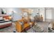 Cozy living area featuring modern furnishings, a workspace, and an open layout in neutral tones and lots of natural light at 2500 S York St # 410, Denver, CO 80210