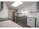 Modern kitchen with stainless steel appliances, subway tile backsplash, and ample counter space at 11205 Holly St, Thornton, CO 80233