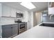 Modern kitchen featuring updated appliances, and ample cabinet space for storage and organization at 11205 Holly St, Thornton, CO 80233