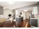 Updated kitchen featuring white countertops, stainless steel appliances, and hardwood floors at 11205 Holly St, Thornton, CO 80233