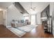 Bright living room with vaulted ceilings, fireplace, and sliding glass doors at 11205 Holly St, Thornton, CO 80233