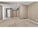 Finished basement showcasing neutral walls, a window, and an open doorway at 14204 E Radcliff Cir, Aurora, CO 80015