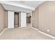 Basement featuring neutral walls, open doorway, cozy carpeting and a double door closet at 14204 E Radcliff Cir, Aurora, CO 80015