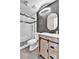 This bathroom features a stylish vanity, framed mirror and modern shower at 14204 E Radcliff Cir, Aurora, CO 80015