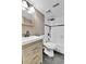 Updated bathroom featuring a modern vanity, subway tile shower, and sleek fixtures at 14204 E Radcliff Cir, Aurora, CO 80015