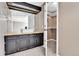 Bathroom with black cabinets and drawers, a white vessel sink, and wood counters at 14204 E Radcliff Cir, Aurora, CO 80015